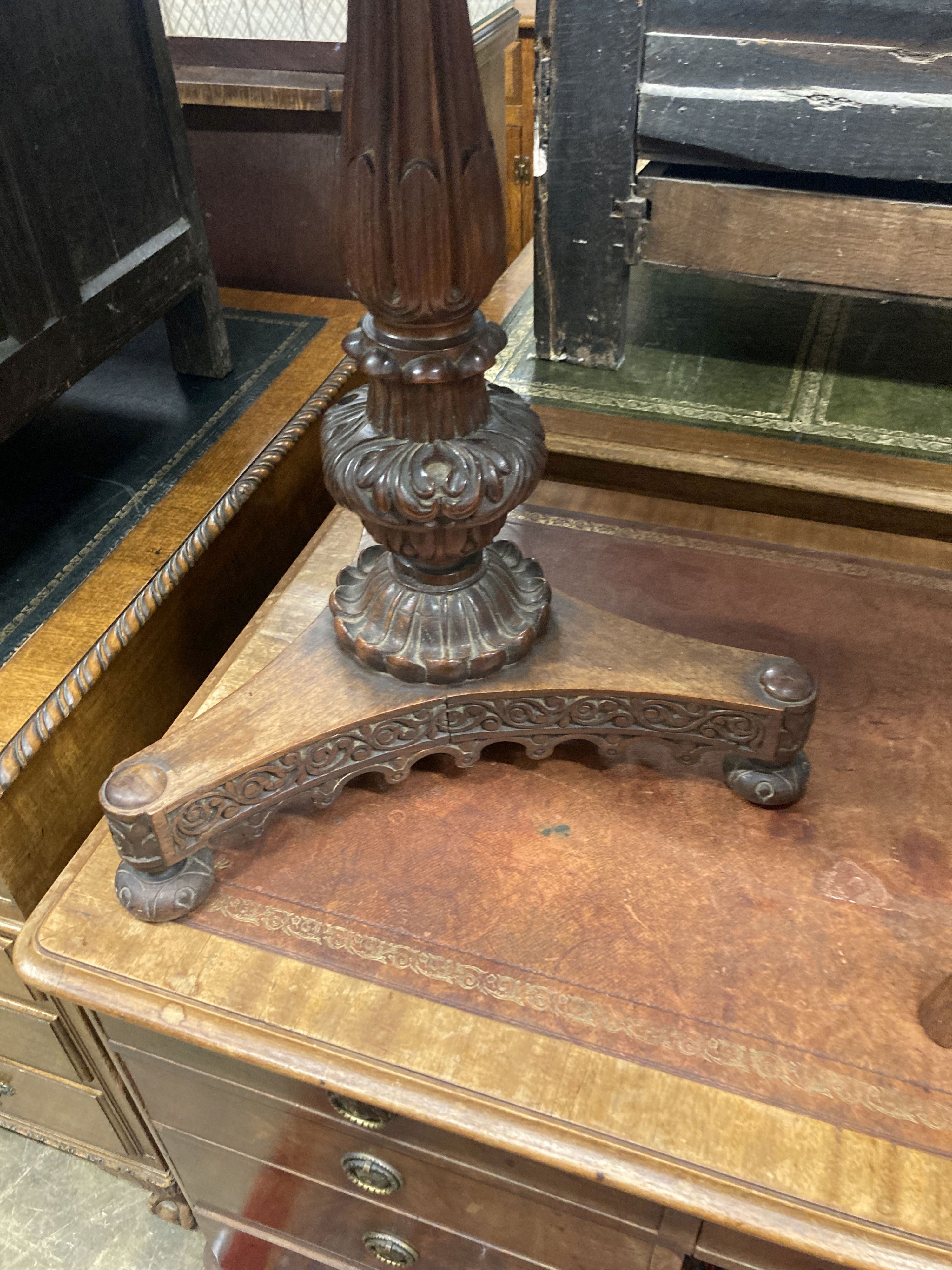 A 19th century Anglo / Indian carved padouk circular tilt top table, 60cm diameter, height 74cm